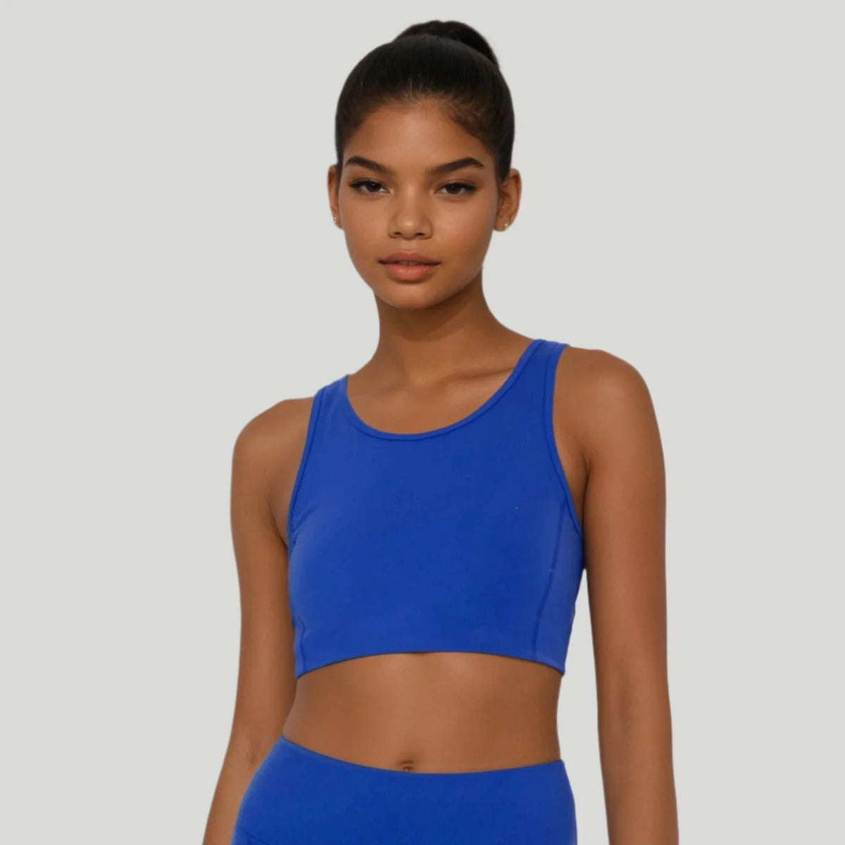 Blue Breathe Easy cut-out back sports bra by Fitkitty Culture, made with Lycra® blend, designed for comfortable active wear.