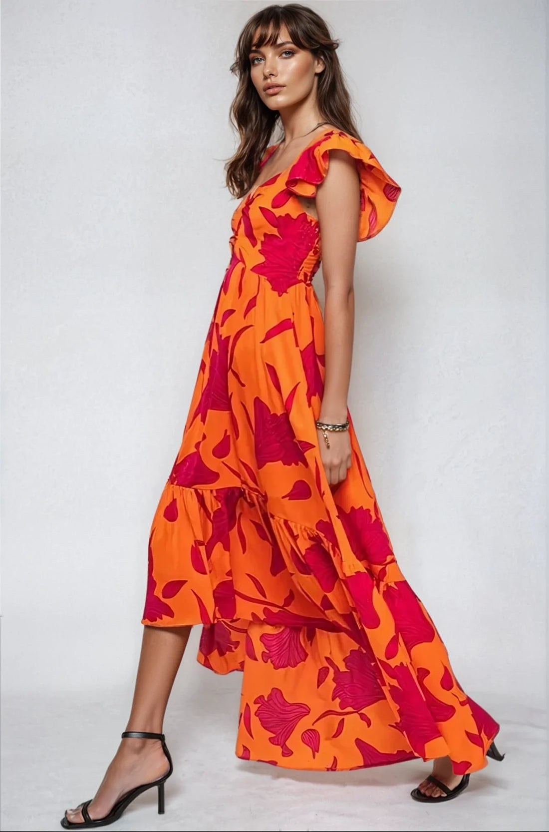 Vibrant fire floral high-low maxi dress by Fitkitty Culture featuring a colorful floral pattern and flowing silhouette.