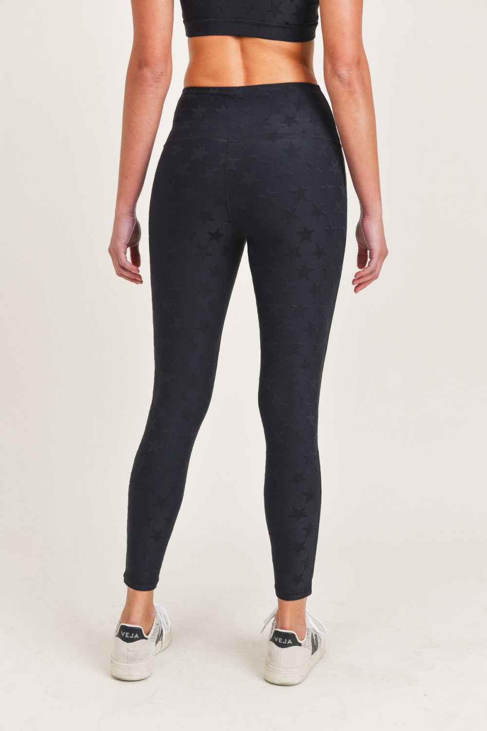Black high waist leggings by Fitkitty Culture Athleisure Wear, featuring a snug fit and stretchy fabric for active and casual wear.