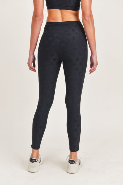 Black high waist leggings by Fitkitty Culture Athleisure Wear, featuring a snug fit and stretchy fabric for active and casual wear.