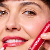 YENSA Luxe Lip Nourishing Oil with Hyaluronic and Vitamin E, smooth and glossy lip oil in a clear bottle with applicator