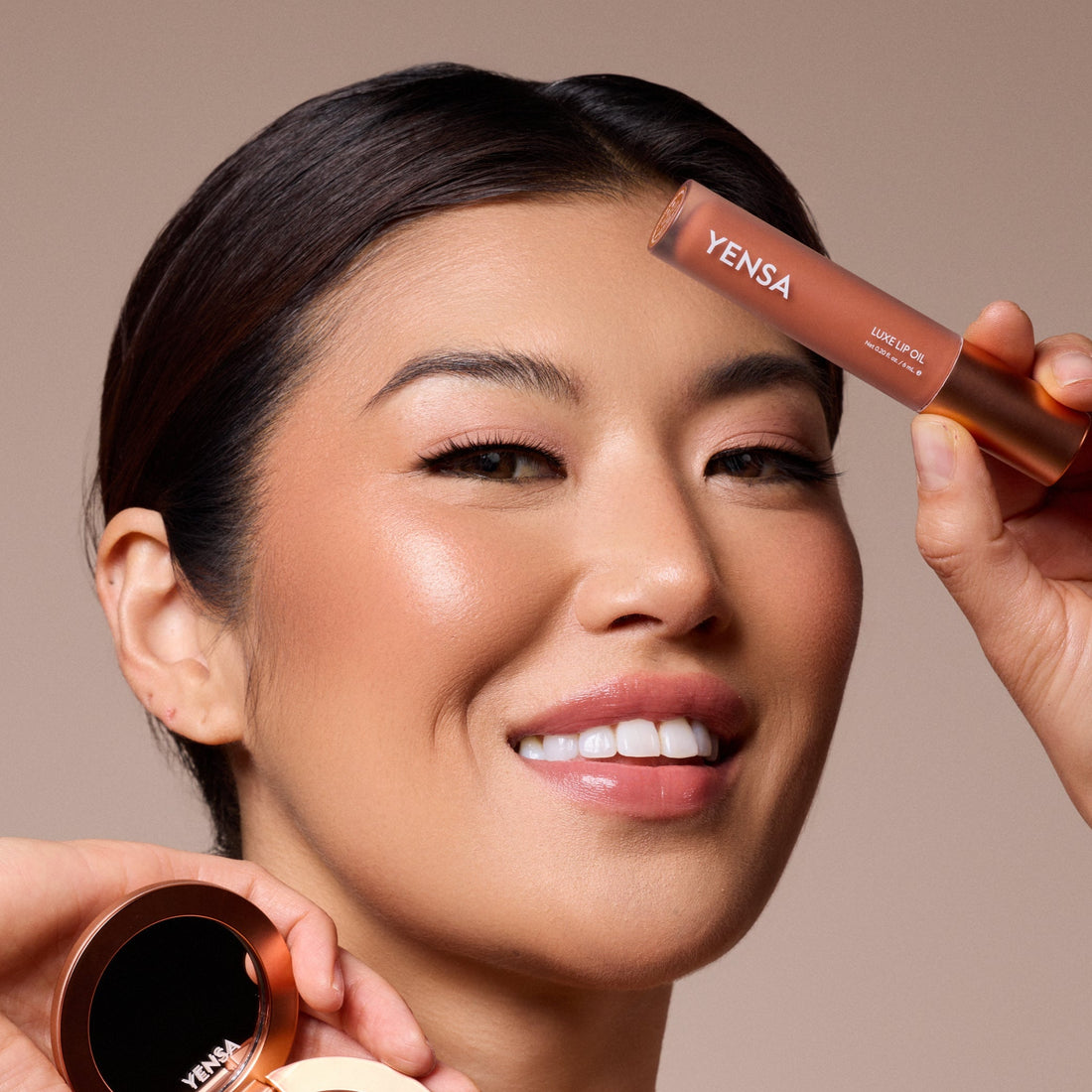 YENSA Luxe Lip Nourishing Oil with hyaluronic acid and vitamin E, featuring a sleek lip oil bottle and applicator.