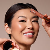 YENSA Luxe Lip Nourishing Oil with hyaluronic acid and vitamin E, featuring a sleek lip oil bottle and applicator.