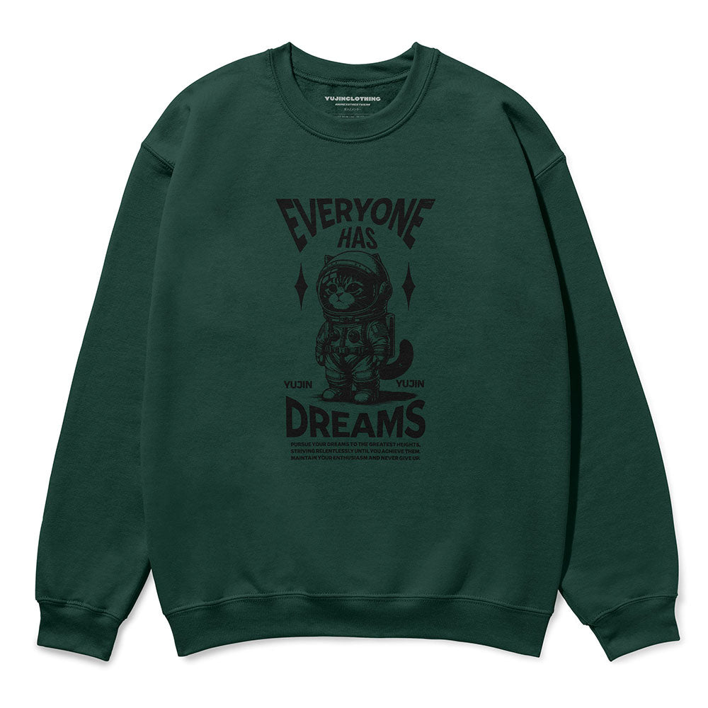 Yūjin Clothing Dream Big Cat sweatshirt featuring a cozy, stylish design with a cat graphic and motivational text on soft fabric.