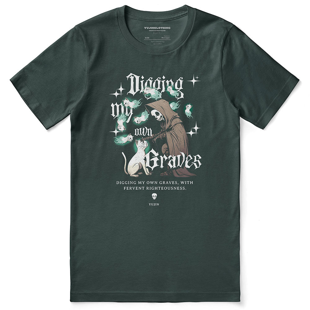 Yūjin Clothing Digging My Own Graves cat T-shirt featuring a graphic of a cat digging on soft fabric background.