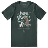 Yūjin Clothing Digging My Own Graves cat T-shirt featuring a graphic of a cat digging on soft fabric background.