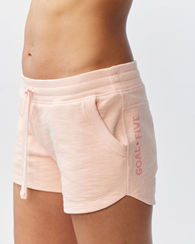 Goal Five Freasy Short in Nectar, lifestyle image showing front and side view of comfortable, casual shorts.
