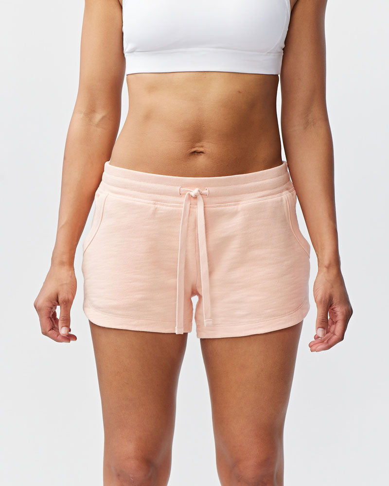 Goal Five Freasy Short lifestyle image showing a pair of nectar-colored shorts with a relaxed fit and casual style.