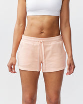 Goal Five Freasy Short lifestyle image showing a pair of nectar-colored shorts with a relaxed fit and casual style.