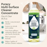 Puracy Everyday Multi-Surface Cleaner in a spray bottle, showing a clean, shiny kitchen countertop with fresh, natural ingredients.