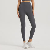 BLACKOUT BARBELL Omni Leggings in dark gray, form-fitting athletic leggings with a seamless design and comfortable stretch fabric.