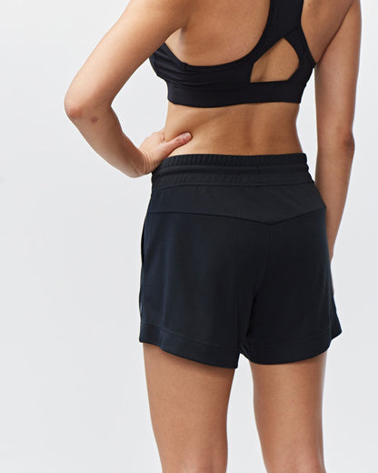 Black Goal Five G5 Advance 4.5-inch knit shorts laid flat showing stretch waistband and smooth knit fabric.