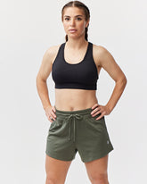 Dark moss green Goal Five G5 Advance 4.5-inch knit shorts displayed on a model, featuring a comfortable fit and stylish design.
