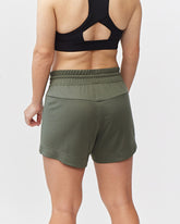 Dark moss Goal Five G5 Advance 4.5-inch knit shorts displayed on a model, showcasing athletic fit and comfortable fabric.