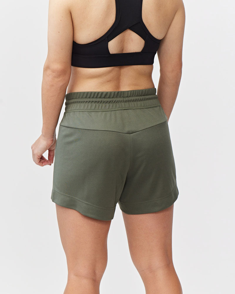 Dark moss Goal Five G5 Advance 4.5-inch knit shorts displayed on a model, showcasing athletic fit and comfortable fabric.