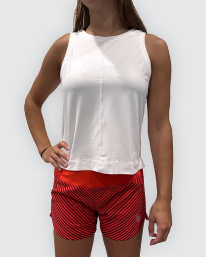 White Goal Five boxy crop tank top displayed on a mannequin, showing its loose fit and sleeveless style.