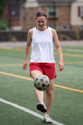 Goal Five boxy crop tank top worn in a casual lifestyle setting, featuring a relaxed fit and modern crop design.
