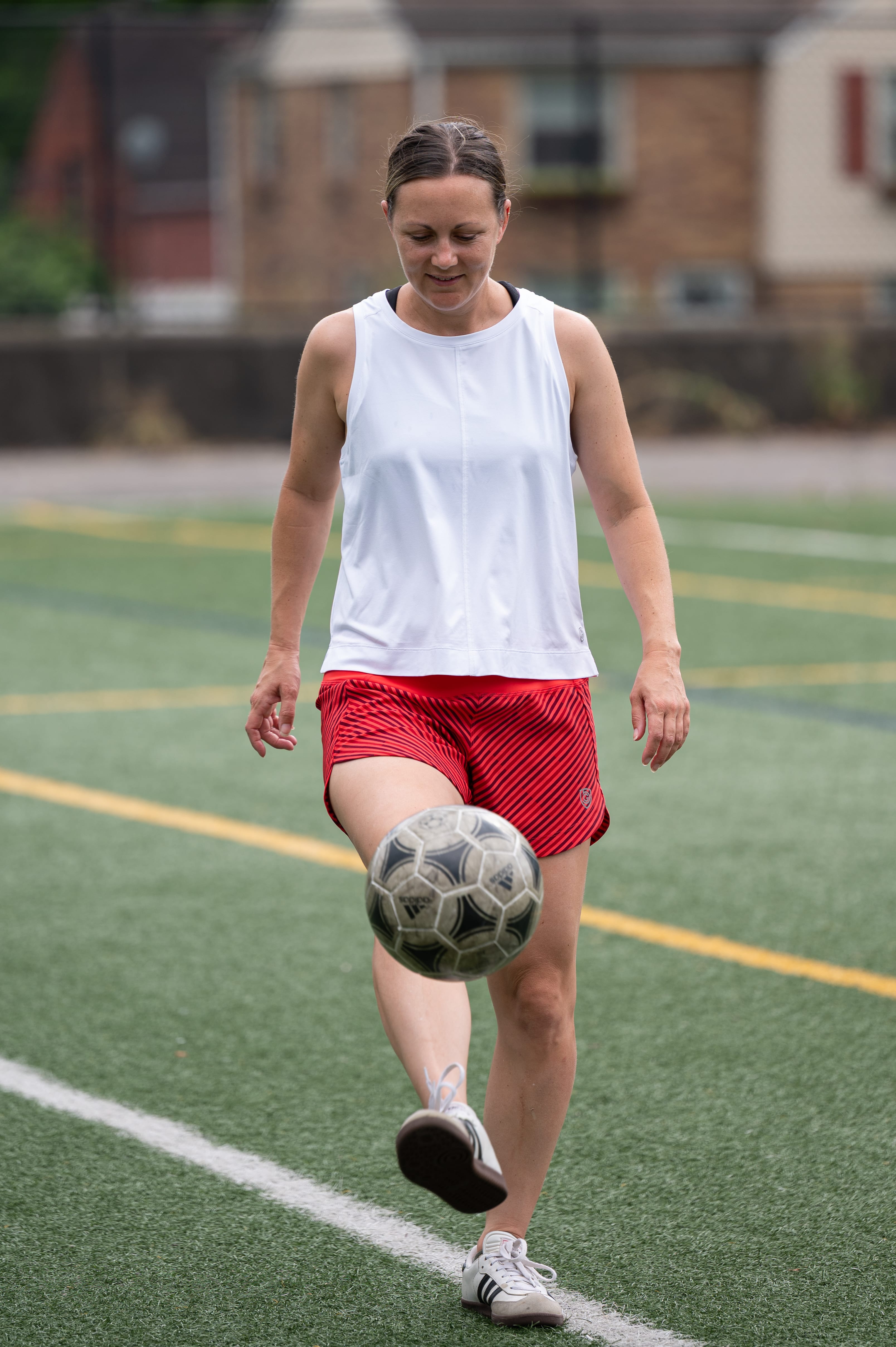 Goal Five boxy crop tank top worn in a casual lifestyle setting, featuring a relaxed fit and modern crop design.