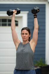 Goal Five boxy crop tank top, shown in a casual fashion, highlighting its relaxed fit and stylish design.