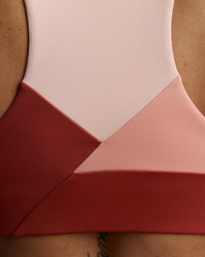 Goal Five Pionxr training bra top in faded rose with cinnabar and nectar detailing, designed for comfortable active wear.