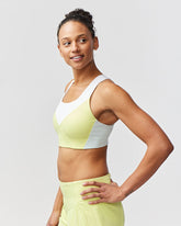 Goal Five Pionxr Bra Top for training, in rose cinnabar nectar color, shown on a model with a fitted, athletic design.