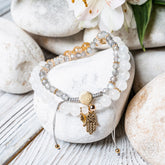 Golden Hand of Fortune jewelry set featuring bracelets of wealth with intricate gold designs, crafted by Conscious Items.