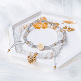 Golden Hand of Fortune jewelry set featuring bracelets of wealth with gold-toned accents, designed by Conscious Items.