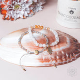 Golden Hand of Fortune jewelry set featuring bracelets of wealth, crafted by Conscious Items, with intricate gold-toned designs