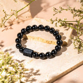 Black Obsidian and Tourmaline bracelet from Conscious Items, featuring natural gemstone beads for positive energy and style.