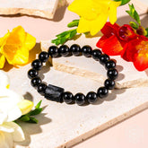 Black Obsidian and Tourmaline bracelet by Conscious Items featuring natural stone beads for spiritual protection and style.