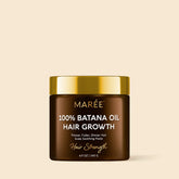 Maree Pure Batana Hair Growth Paste in a jar, showing the natural hair care product with a smooth paste texture.