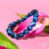 Royal blue Tiger’s Eye bracelet by Conscious Items featuring a sleek, polished design with a stretch cord for a comfortable fit.