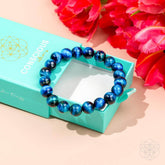 Royal blue Tiger’s Eye bracelet by Conscious Items featuring a sleek beaded design and a secure elastic band.