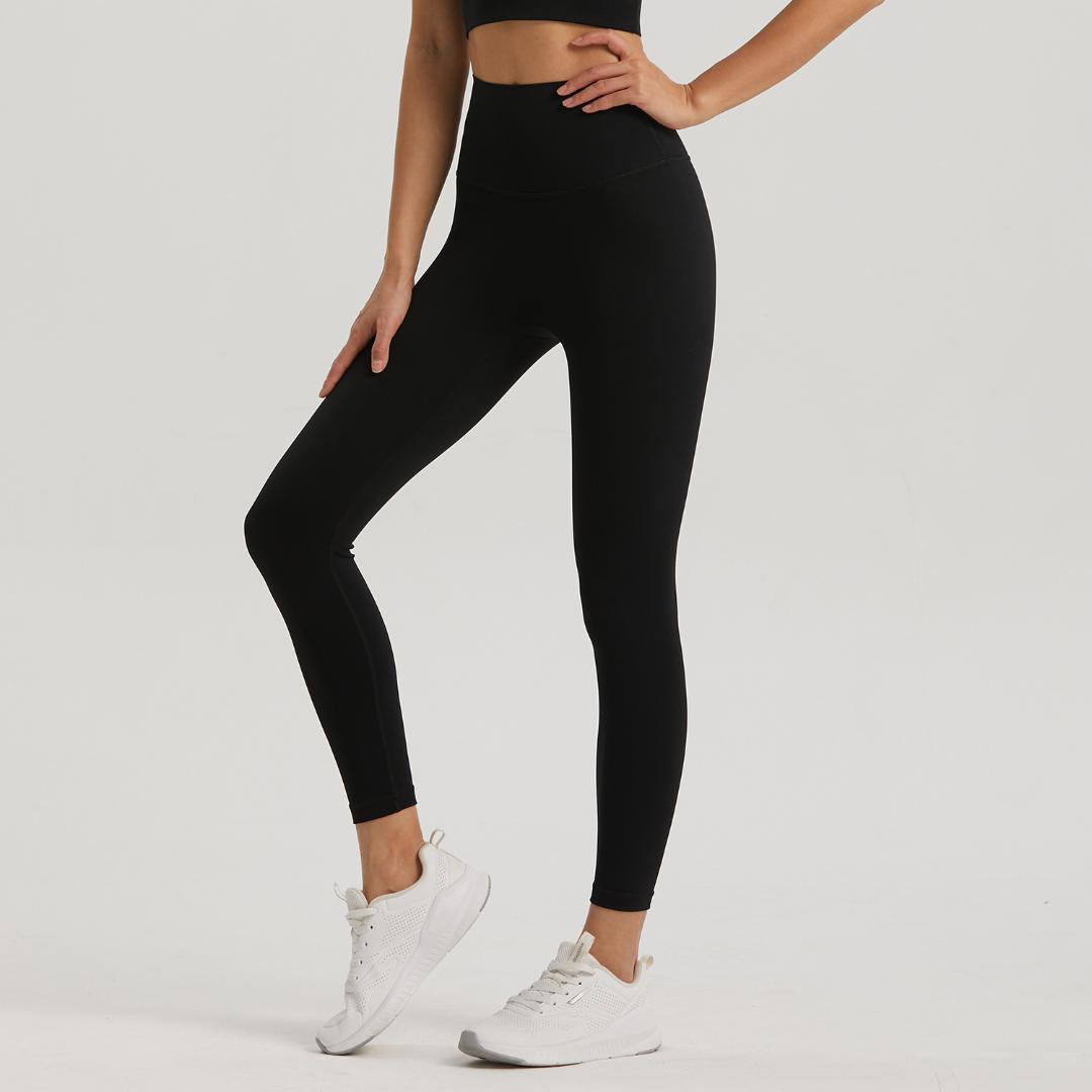 Black Omni leggings by BLACKOUT BARBELL in black fabric, shown in a close-up image highlighting the stretchy, fitted design.