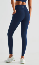 BLACKOUT BARBELL Koa Leggings in navy, form-fitting activewear with a sleek waistband and smooth fabric, perfect for workouts.