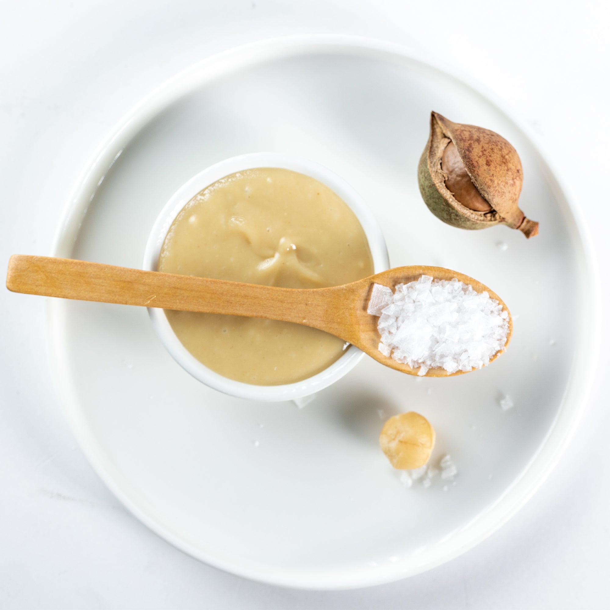 House of Macadamias Sea Salt Macadamia Nut Butter jar with label, showcasing creamy texture and sea salt flavor.