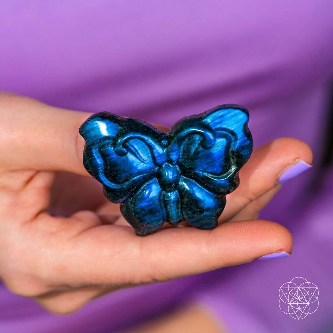 Labradorite crystal heart carving titled "I Am Reborn" by Conscious Items, showcasing iridescent stone with a smooth, polished finish.