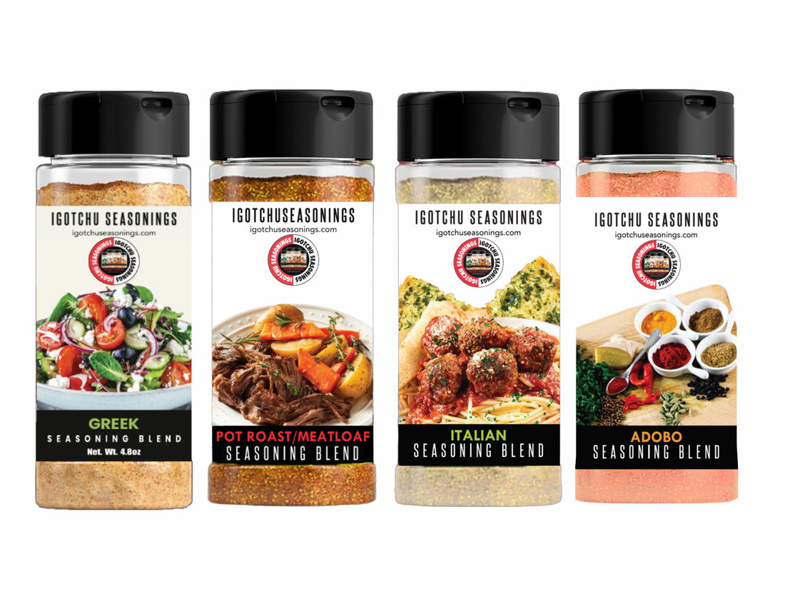 Close-up of The Mediterranean seasoning blend by Igotchu Seasonings in a clear glass jar with a label and colorful herbs inside.