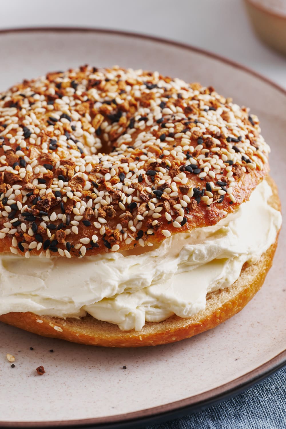 Igotchu Seasonings everything bagel seasoning in a jar, with visible sesame, poppy seeds, and dried garlic and onion bits.