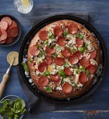 Igotchu Pizza seasoning in a jar, with a blend of herbs and spices, perfect for flavoring homemade pizza and Italian dishes.