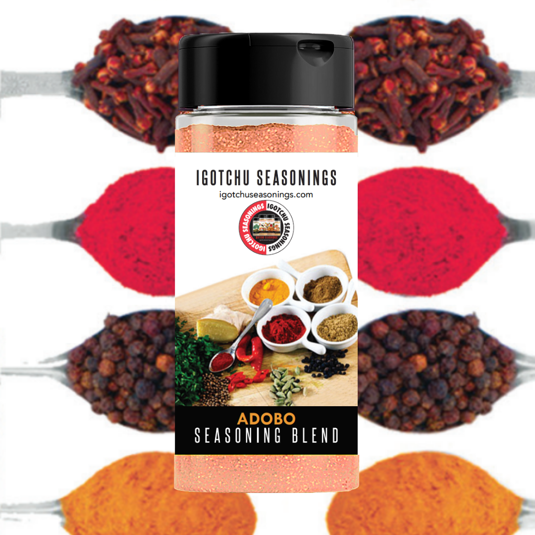 Igotchu Adobo seasoning in a jar, featuring a blend of spices used for savory Filipino dishes, displayed with a spoon and spices.