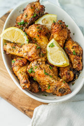 Igotchu Lemon Garlic Pepper seasoning in a jar, showcasing fresh lemon, garlic, and black pepper spices for flavorful cooking.
