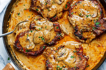 Igotchu Pork Chop seasoning container with spices, highlighting seasoned pork chop on a plate ready to serve.
