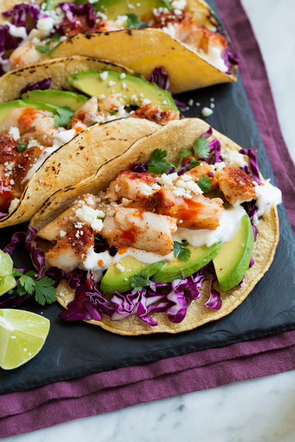 Freshly seasoned seafood dish featuring Igotchu Seafood Seasoning, showcasing vibrant spices on grilled seafood.