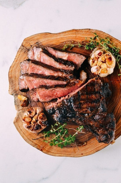 Igotchu Steak Seasoning container with a close-up of seasoned grilled steak on a plate, highlighting flavor and spice blend.