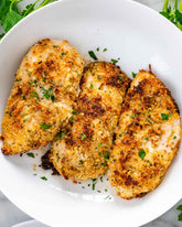Igotchu Ranch seasoning in a jar, with fresh herbs and spices, ideal for salads, dips, and grilled dishes.