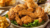Igotchu Seasonings fried chicken and fish coating mix in a bowl, seasoned with spices for crispy Southern-style fried dishes.