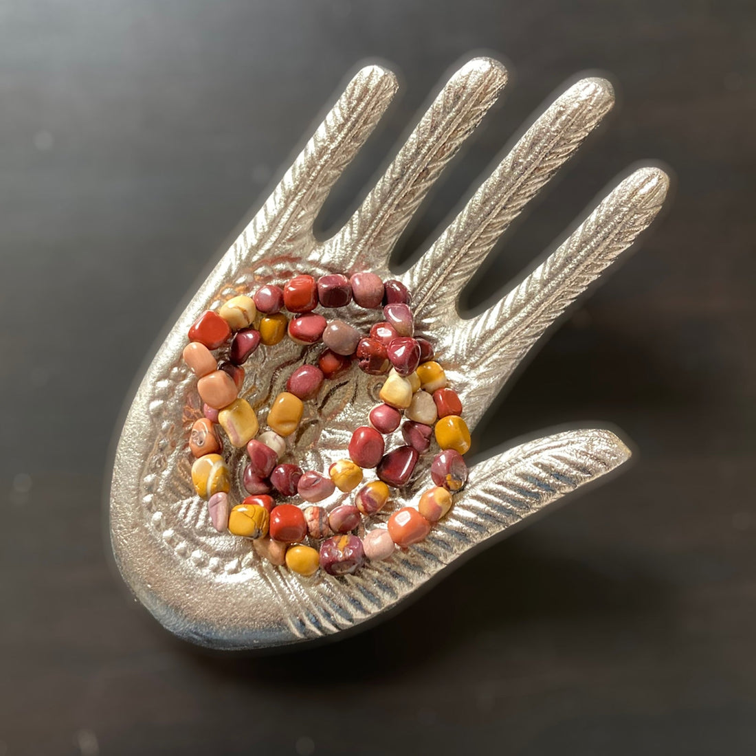 Evermore Everlasting Mookaite stretch bracelet with multicolored gemstone beads on a white background.