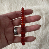Faceted rondelle beaded bracelet by Evermore Everlasting featuring shiny, multicolored glass beads on a stretchy elastic band.