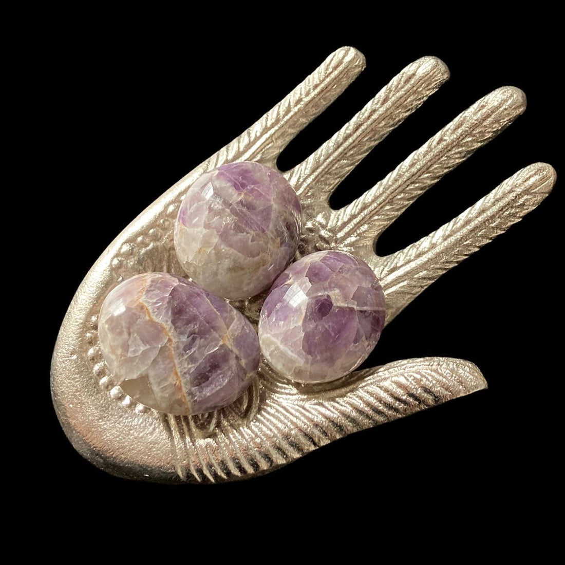 Amethyst palm stone from Evermore Everlasting showing a polished purple crystal palm-sized healing stone.